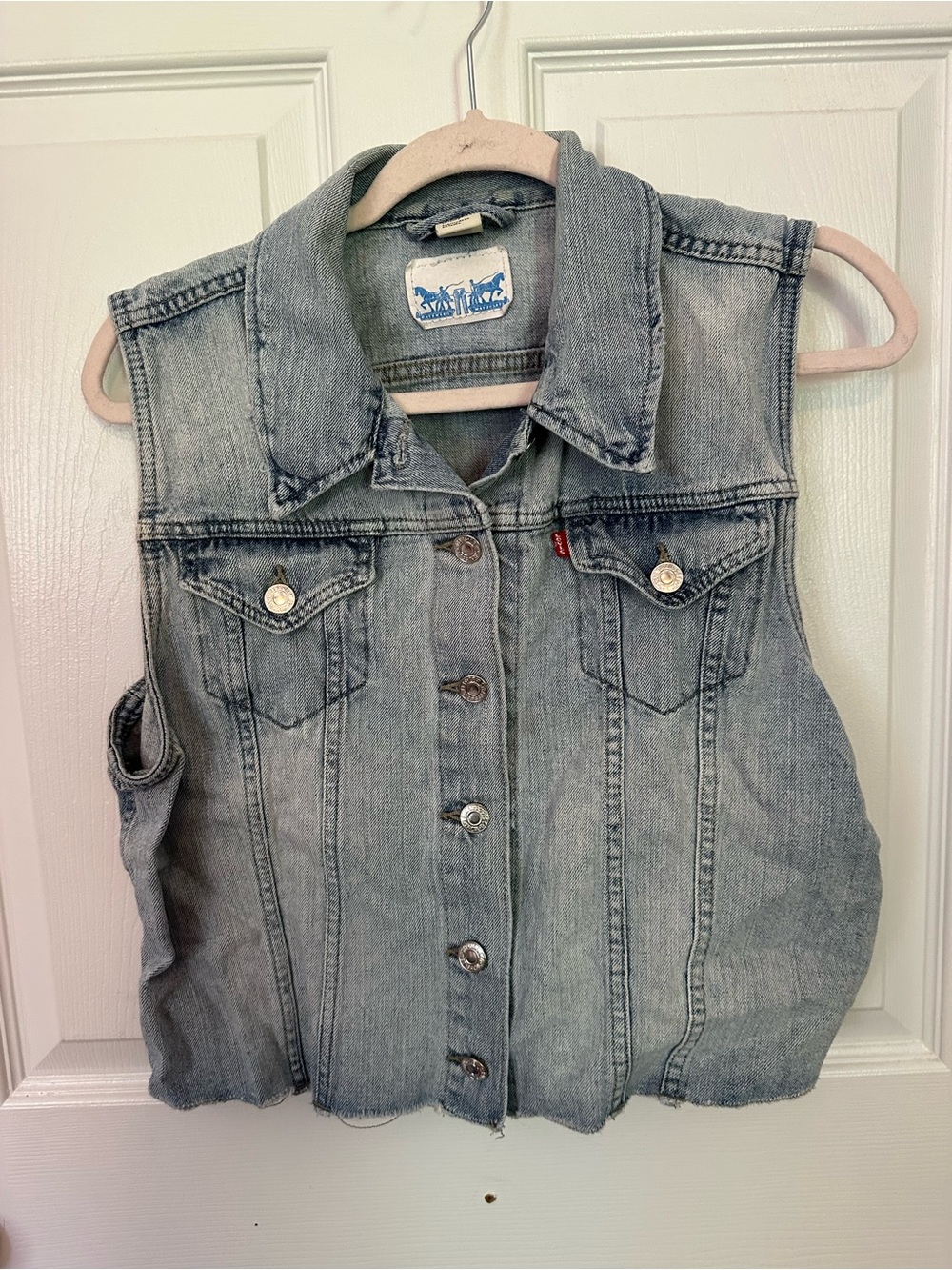 Levi's light blue denim vest with blue logo patch